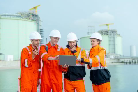 Petrochemical factory workers and technicians working together