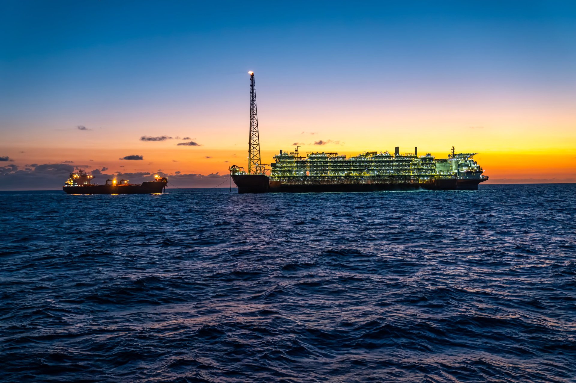 FPSO and offshore vessels at sunset